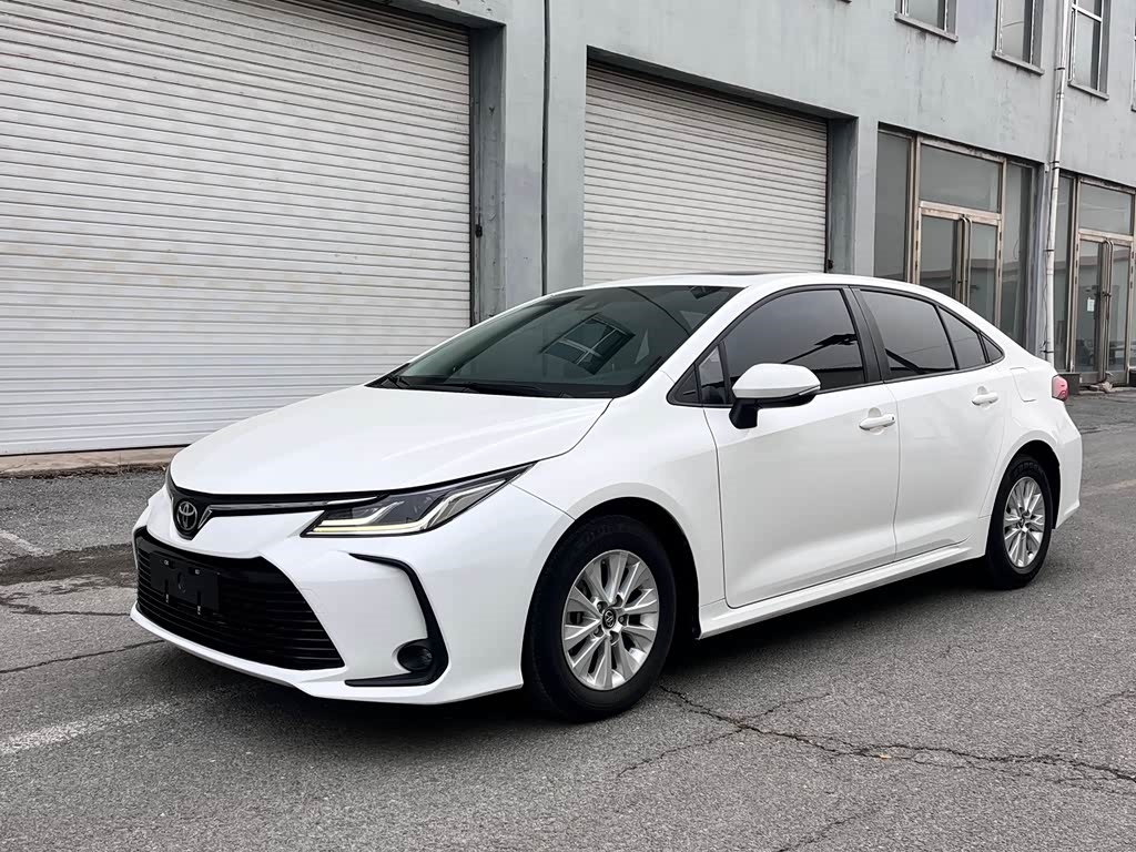 White 2021 Toyota Corolla sedan, representative used export vehicle